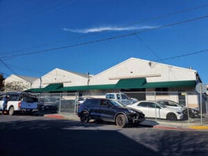 Custom green awning in front of business