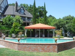 Custom awning over lounge area at a pool