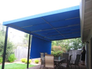 Custom blue awning and vertical curtain