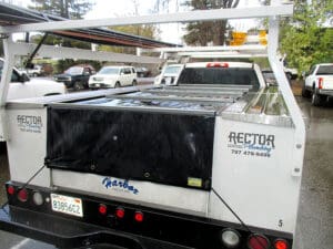 A Reaco Brand Tarp cover over a Utility Truck Bed