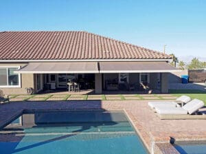 Polar Shades Retractable Awning Over Pool Lounge Area