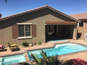 Polar Shades Retractable Awning Over Pool Lounge Area