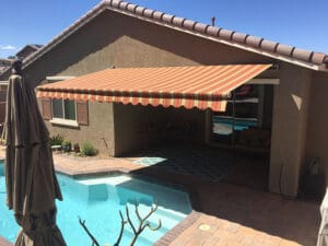 Polar Shades Retractable Awning Over Pool Lounge Area