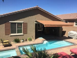 Polar Shades Retractable Awning Over Pool Lounge Area