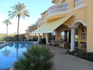 Polar Shades Retractable Awning Over Pool Lounge Area