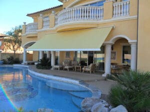 Polar Shades Retractable Awning Over Pool Lounge Area