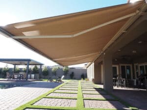 Polar Shades Retractable Awning Next To Pool Lounge Area