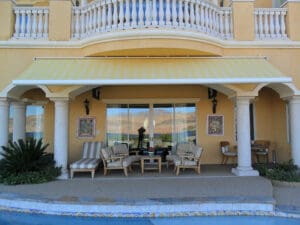 Polar Shades Retractable Awning Over Pool Lounge Area