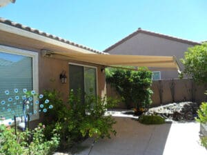 Polar Shades Retractable Awning Over Sliding Glass Door Leading To Backyard